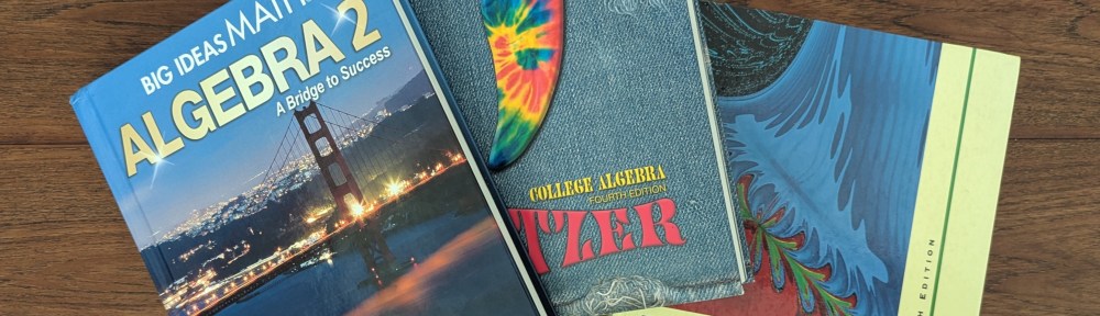 A photograph of three textbooks fanned out on a wooden table. They are Algebra 2 by Ron Larson and Laurie Boswell, College Algebra by Robert Blitzer and Precalculus by David Cohen.